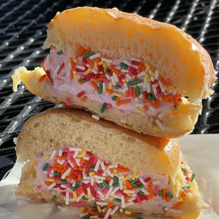 Strawberry Ice cream sandwich donut with sprinkle.