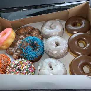 Chocolate, blueberry, choc. With sprinkles, a fritter, and strawberry glaze