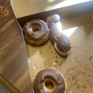 a box of chocolate frosted donuts