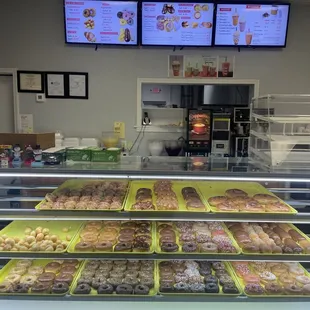 a display case with a variety of donuts