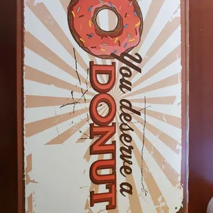 a sign with a donut on it