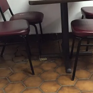 Cracked floor with cardboard propping up the tables ! Looks like it&apos;s just weeks from going out of business.