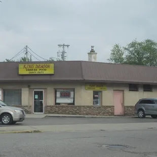 cars parked in front of a restaurant