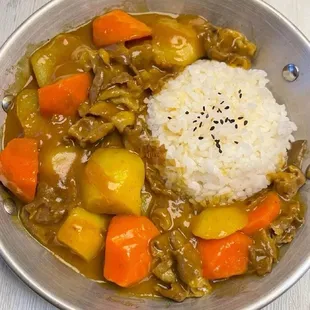 a bowl of stew and rice
