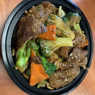 Bowl with chow mein and Broccoli Beef. Very saucy and salty but a nice splurge