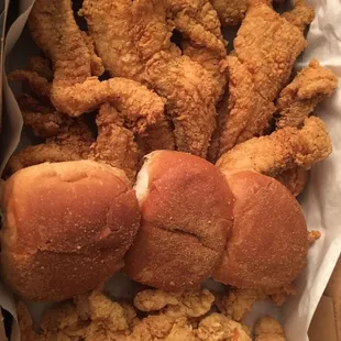 Fish, bread, shrimp, fries, potato salad, hush puppies.