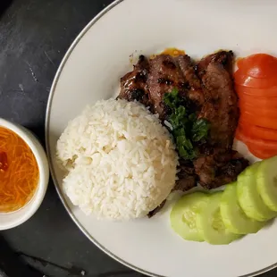 Charcoal broilerd Beef With Steam rice tomatoes and cucumber