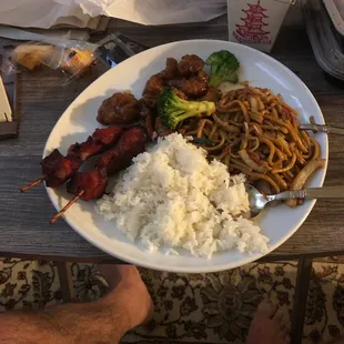 General So's chicken,Roast Pork Lomein, chicken Teriyaki sticks and rice.