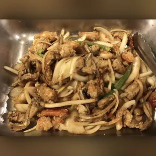 a plate of noodles with meat and vegetables
