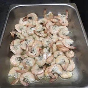 shrimp being cooked in a pan