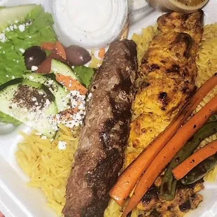 This is their Combination Plate: Adana kabob, chicken shish kabab served with yellow basmati rice and salad.