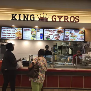 two people standing at the counter