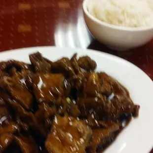 a plate of beef and rice
