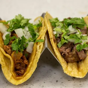 three tacos on a tray