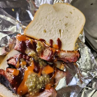 a pulled pork sandwich with bbq sauce