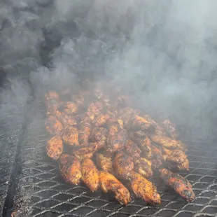 smoke coming out of a grill