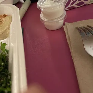 Two tiny containers of garlic sauce for 3 plates!!