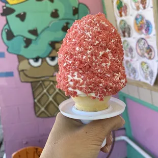Vanilla soft serve with strawberry crunch coat