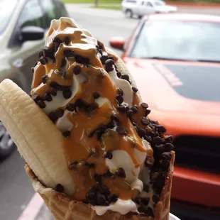 The Chunky Monkey- nutella lined waffle cone, vanilla soft serve,  banana, peanut butter, and chocolate chips.