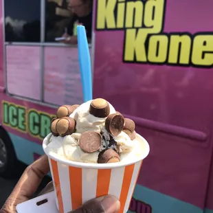 1 Aug. 2019 -- King Kone Ice Cream Truck at work. Salty Caramel Truffle and Vanilla Moose Tracks ice cream with buckeye chocolates on top.