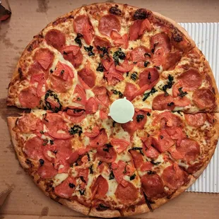 Build your own pizza with pepperoni, basil, tomatoes and extra sauce.