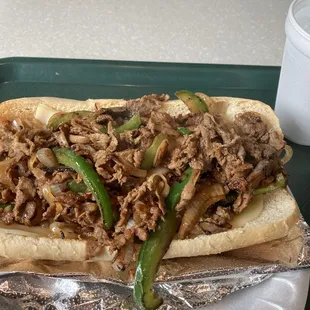 Cheesesteak with peppers, onions, and mushrooms.
