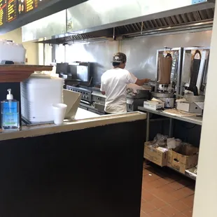 Cook not wearing mask while preparing food.