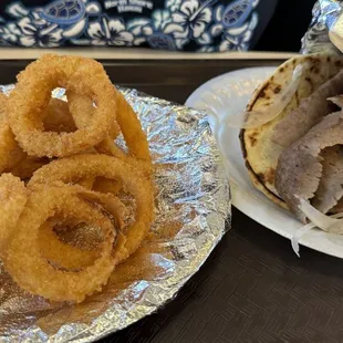 Gyro sandwich no tomatoes with onion rings