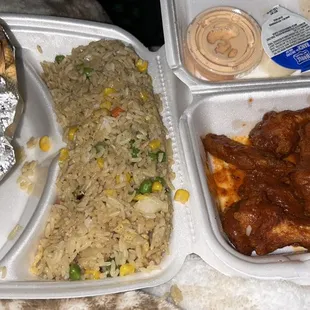 a tray of food and a container of rice