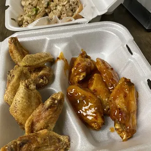 chicken wings and rice in a styrofoam container