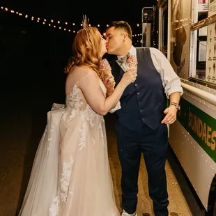 a bride and groom kissing