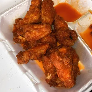 chicken wings in a styrofoam container