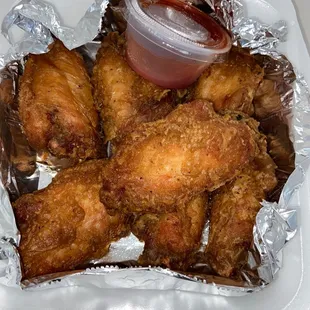 chicken wings in foil with ketchup