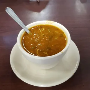 a bowl of soup on a saucer