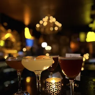 a variety of drinks on a bar