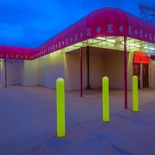 neon poles in front of a building