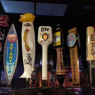 a row of beer taps