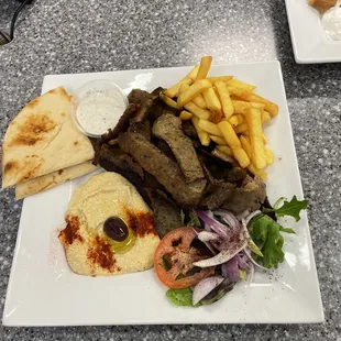 Gyros&apos;s Plate comes with your choice of 2 sides and drink