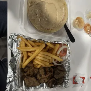 Beef Souvlaki Plate with fries and hummus.