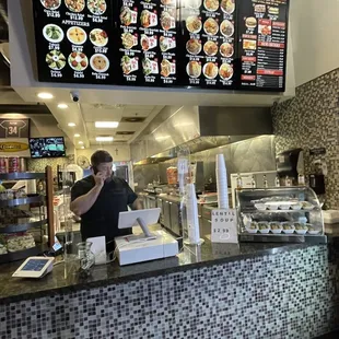 a man at a restaurant counter