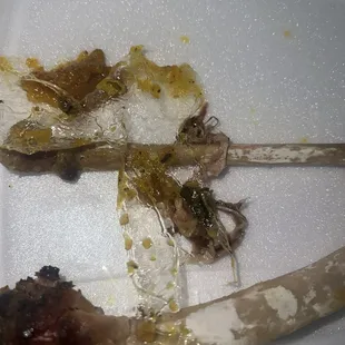 Plastic between turkey wings and collard greens