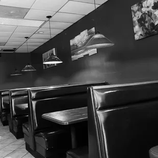 a black and white photo of a restaurant