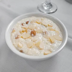 a bowl of rice pudding with almonds