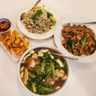 Clockwise from 12 o' clock: Crab Meat Fried Rice, Pad See Ew Chicken, Rad Nar Seafood, Deep Fried Calamari.
