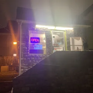 an open sign in front of a building