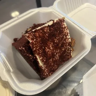 a piece of cake in a styrofoam container