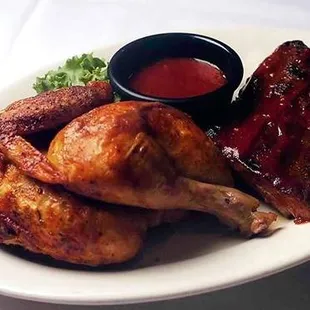 a plate of food with meat and sauce
