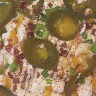 loaded fries w shredded cheese instead of cheese sauce with peppers.