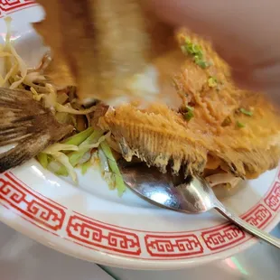 a plate of food being eaten