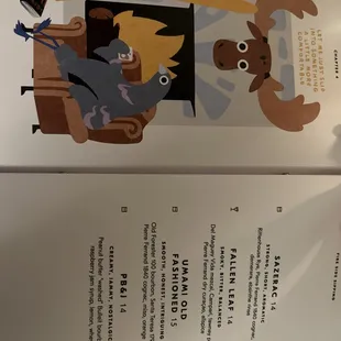 an open book with a picture of a dog and a cat